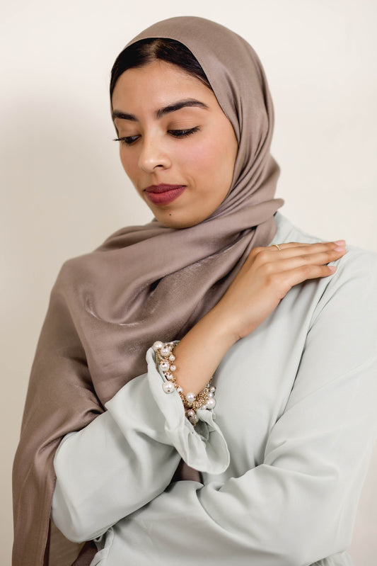 Elevate your style with our posh mink hijab scarf by Charmeuse Designs. Our hijabs, scarves, and shawls are made of Polyester Silk and are non-slip, soft, and breathable.